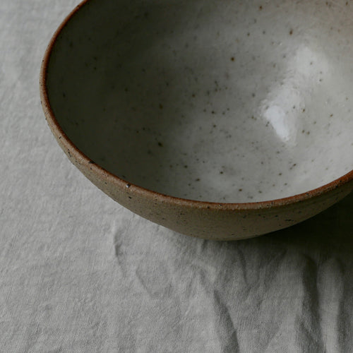 Flecked clay bowl, glazed inside