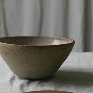 Flecked clay bowl, glazed inside