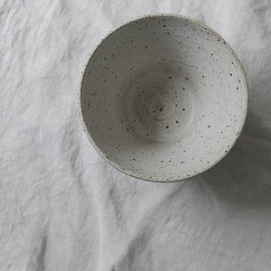 white flecked fluted small bowl in matt glaze