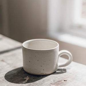handmade white flecked coffee mug