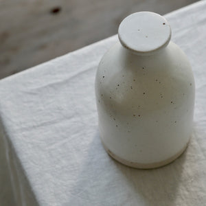 white flecked stoneware bottle